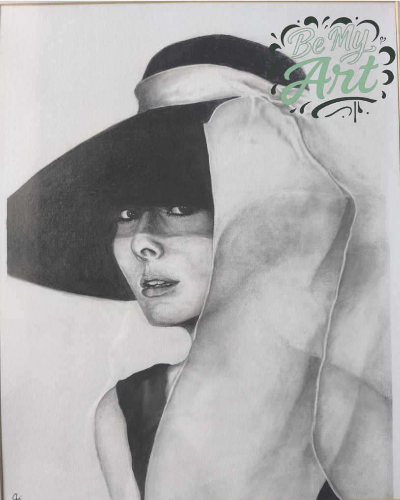 A striking graphite portrait of Audrey Hepburn, defined by dramatic contrast and controlled tonal depth. The sweeping brim of her hat casts a deliberate shadow across her eyes, creating a powerful interplay between concealment and presence.